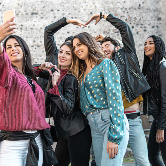 group-young-friends-ancient-city-center-taking-selfie-with-smart-phone-seven-people-have-fun-together-1